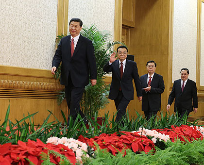 General Secretary of the Central Committee of the Communist Party of China (CPC) Xi Jinping leads and the other newly-elected members of the Standing Committee of the 18th CPC Central Committee Political Bureau to a press conference. Xinhua.