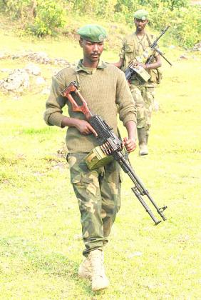 Two members of M23 rebels group on patrol in Eastern Congo. Net photo.