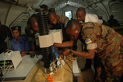 Army and police personnel in a past arms marking exercise. Marking  is one way of fighting prolifiration of small arms. The New Times /  File.