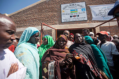 Women in Darfur pause for a photo in front of the market built for them by Rwandan peacekeepers. The New Times courtesy