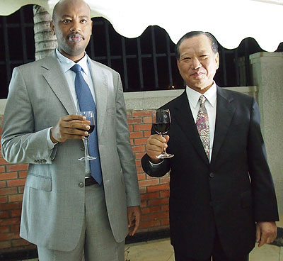 Minister Albert Nsengiyumva  toasts with Kunio Hatanaka, Japanese Ambassador to Rwanda at the birthday celebrations of Japanese Emperor in Kigali. The New Times / Courtesy.