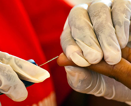 A patient taking an HIV test yesterday. The New Times / T. Kisambira.