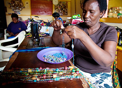 Judith Mukabalisa, 52 making a necklace at her work place. The New Times/File.