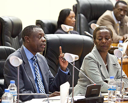 The Minister of Defence, James Kabarebe (L) with the Minister of Foreign Affairs, Louise Mushikiwabo, at Parliament yesterday. The New Times / T. Kisambira.