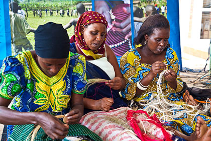 Rwandan women weaving baskets. The country needs to further reduce its reliance on aid. The New Times / File. 