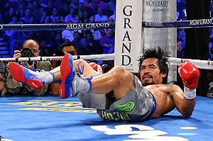 Pacquiao hits the canvas after Marquez connects with a right in the third. Net photo.