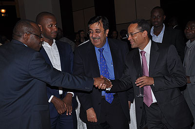 Amb Claver Gatete, Governor, National Bank of Rwanda; Robert Kayitani of TRANCOM Ltd; Sanjeev Anand, Managing Director, BCR; and Guilles Guerrard, Managing Director, Ecobank; at the launch of the Rswitch card last week.