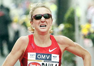 Paula Radcliffe reacts after running the half marathon race during the Vienna City Marathon.