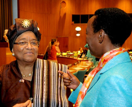 The late Aloisea Inyumba (Back to the camera) chatting with Liberiau2019s President Johnson Sirleaf at the UNGA meeting on Peace and Security through Womenu2019s Leadership.