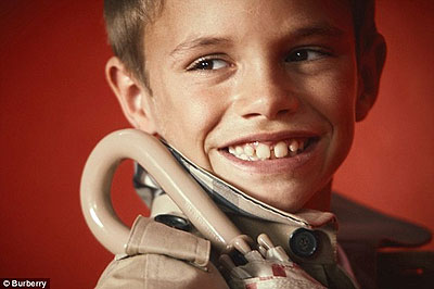 Cheeky grin: The young Beckham boy stars alongside some of the newest modelling talent in the shoot. Net photo.