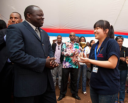 RPF vice chairman Christophe Bazivamo (L), chats with Khai Xim of FUBISUN the best Foreign exhibitor at the Prosperity Expo yesterday. The New Times/T. Kisambira.