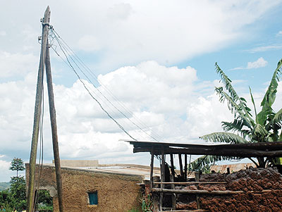 Overhead cables connecting rural homes to electricity. The New Times/Stephen Rwembeho.