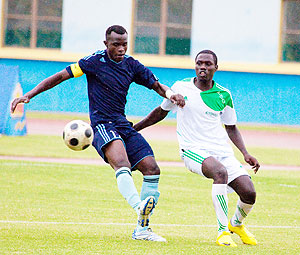 Striker Peter Kagabo shields the ball from SC Kiyovuu2019s defender. Kagabo will be vital for Police FC as they seek to extend their lead at the top of the league table with a win against Musanze at Kicukiro today. The New Times / T. Kisambira. 