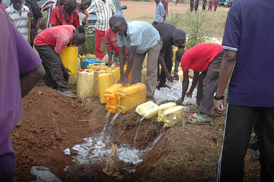 Residents destroying drugs. Proliferation of the illicit brew is rampant in the Eastern Province. The New Times / File.