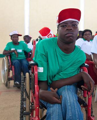 A child with disability attends a meeting at Petite Stade last week. The New Times / Timothy Kisambira.