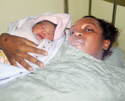 Martha Uwiragiye  with her new born baby at Hopital La Croix Du Sud yesterday. The New Times/John Mbanda.