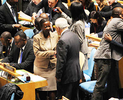 Rwandan representatives are congratulated after Rwanda was elected as new non-permanent member of the United Nations Security Council at the headquarters in New York, Oct. 18, 2012.