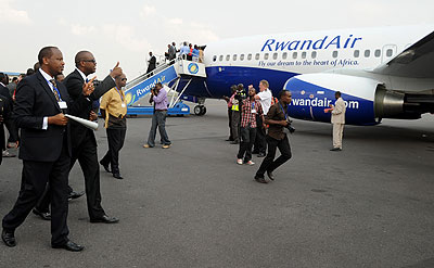 Infrastructure Minister Albert Nsengiyumva (L) with Rwandair CEO John Mirenge at the inauguration of the Boeing 737-800 in August 2011. The New Times, J. Mbanda