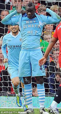 Balotelli displays his famous 'Why Always Me' t-shirt after scoring against Manchester United last season. Net photo.