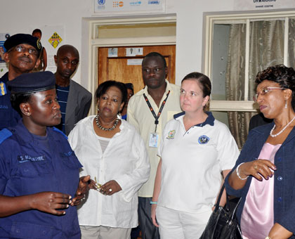 The Director of Isange One Stop Centre, AIP Shafiga Murebwayire, explains to Gasarabwe (Right)  how the centre operates. The New Times/ Courtesy.