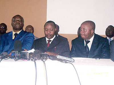 Francois Rucogoza (C) flanked by Roger Lumbala, a DRC opposition parliamentarian (L) and other M23 officials address journalists in Kampala yesterday. The New Times/ G. Muramira