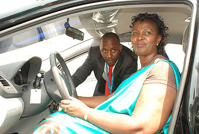 Beatrice Umutesi, the lucky winner of  Ecobanku2019s Hyundai Accent tests her car