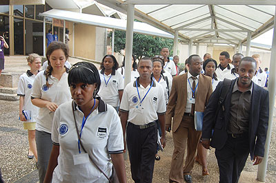 Participants head for the conference room at the Senate building yesterday. The New Times/ Clement Uwiringiyimana