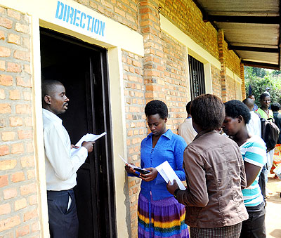 ABOVE: Students from APPERWA school receive transfer documents last week, while below are students from Lycu00e9e Notre Dame school. New Times/ J. Mbanda