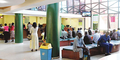 People queue for services at a bank in Kigali. Northern Province leaders are working with banks to boost  access to financing, which has improved the lives of the residents in the region.  Net photo.