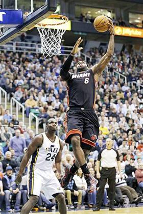 Miami Heat orward LeBron James (6) goes to the basket as Utah Jazz forward Paul Millsap (24) looks on in the second quarter. Net photo.