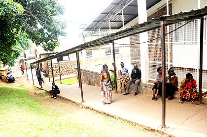 Patients sit in the corridor of CHUK on Tuesday. The New Times/ John Mbanda