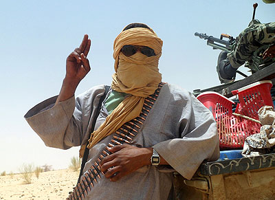 One of Maliu2019s Islamist rebels, a member of extremist group Ansar al-Dine, gestures to the camera.  Net photo.