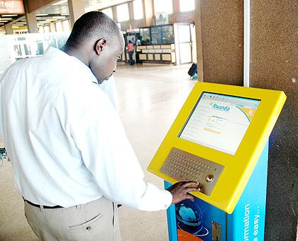 A man browses the internet from a public kiosk. The New Times / File.