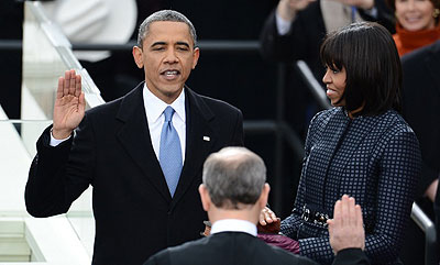 President Obama publicly swears in for second term as US President by Chief Justice John Roberts Jr. Right is First Lady Michelle. Net Photo.