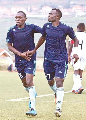 Meddie Kagere (L) and Peter Kagabo (R) celebrating after the latter scored the second goal for Police against La Jeunesse yesterday. Sunday Sport/ T. Kisambira.