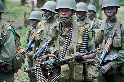 Congolose troops in Rutshuru during a past operation. Monusco has been accused of ignoring the threat posed by the FDLR militia, who reportedly enjoy support of some Congolese army commanders. Net photo.