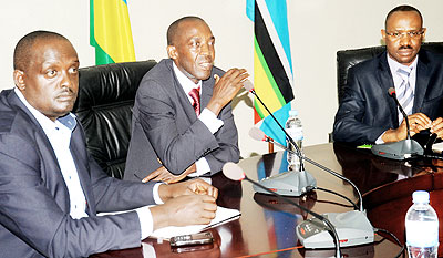 Agacirou2019s Ngerero speaks at the hand-over of the money changersu2019 contribution yesterday. He was flanked by Kamushana and Hategekima. The New Times/ John Mbanda.