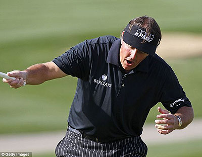 Phil Mickelson after missing his birdie putt on the ninth hole that would have given him a round of 59. Net photo.