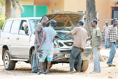 Roadside mechanics at work on the street in Biryogo recently. The New Times/ Timothy Kisambira