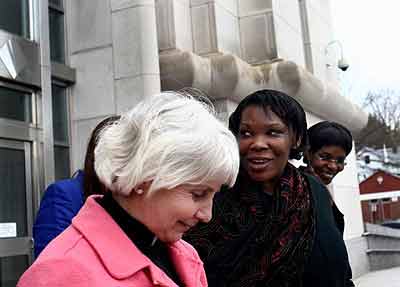 Munyenyezi (C) turns to speak to reporters after she was granted bail last year.  The New Times/ Net.