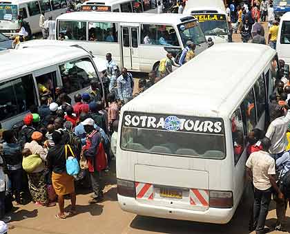 Passengers and cars now have to compete for space in the small parks. The New Times/  Timothy Kisambira. 