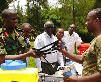 Brig. Gen.  Bagabo gives out a Tool Kit to one of the 7,200  ex-combatants The New Times/ Courtsey