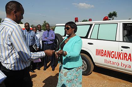 Health Minister Dr. Agnes Binagwaho (R) hands over one of the Ambulances to Gisenyi Hospital Director Dr William Kanyankore. Sunday Times / John Mbanda.