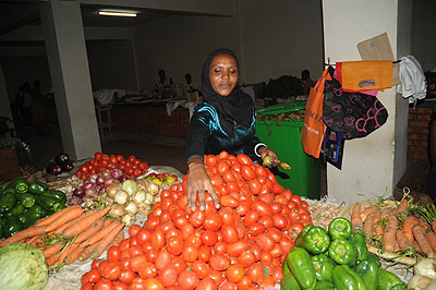 A woman trader at a  vegetable stall. More women are acquiring loans to do business.