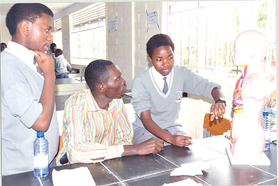 Franu00e7oise Niyigena (R) during an anatomy class in the school labaratory. The New Times/Courtesy.