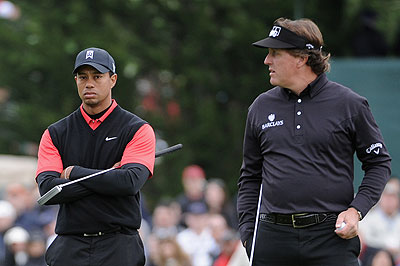 Tiger Woods (left) and Phil Mickelson are both eying victory next week in the year's opening major. Net photo.