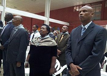 Frank Kayijuka (R), the Second Counselor at the Rwanda High Commission in Tanzania ,and Rwanda Diaspora members participate in prayers at Arushau2019s Zion City Church. Courtesy.