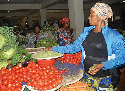 Tomotoes now cost Rwf1,100, while bananas will set you back by Rwf200. The New Times / Peterson Tumwebaze