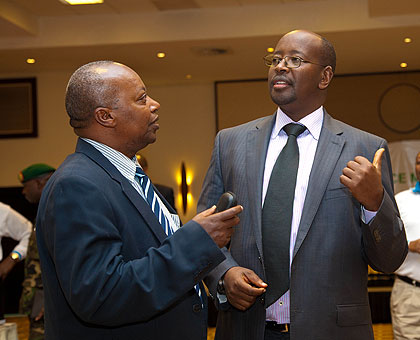 Cu00e9lestin Kabahizi , the Governor of Western Province (L) chats with  Musoni after the meeting.  The New Times/Timothy  Kisambira. 