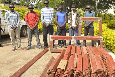 The suspects paraded at Remera Police Station with the recovered items.  The New Times/ Laurent Kamana.